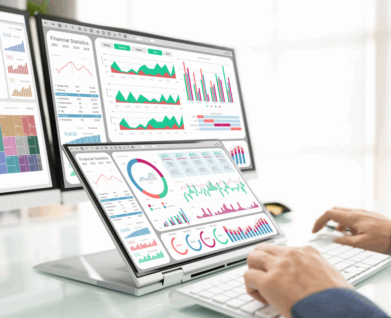Multiple screens displaying data charts and graphs.