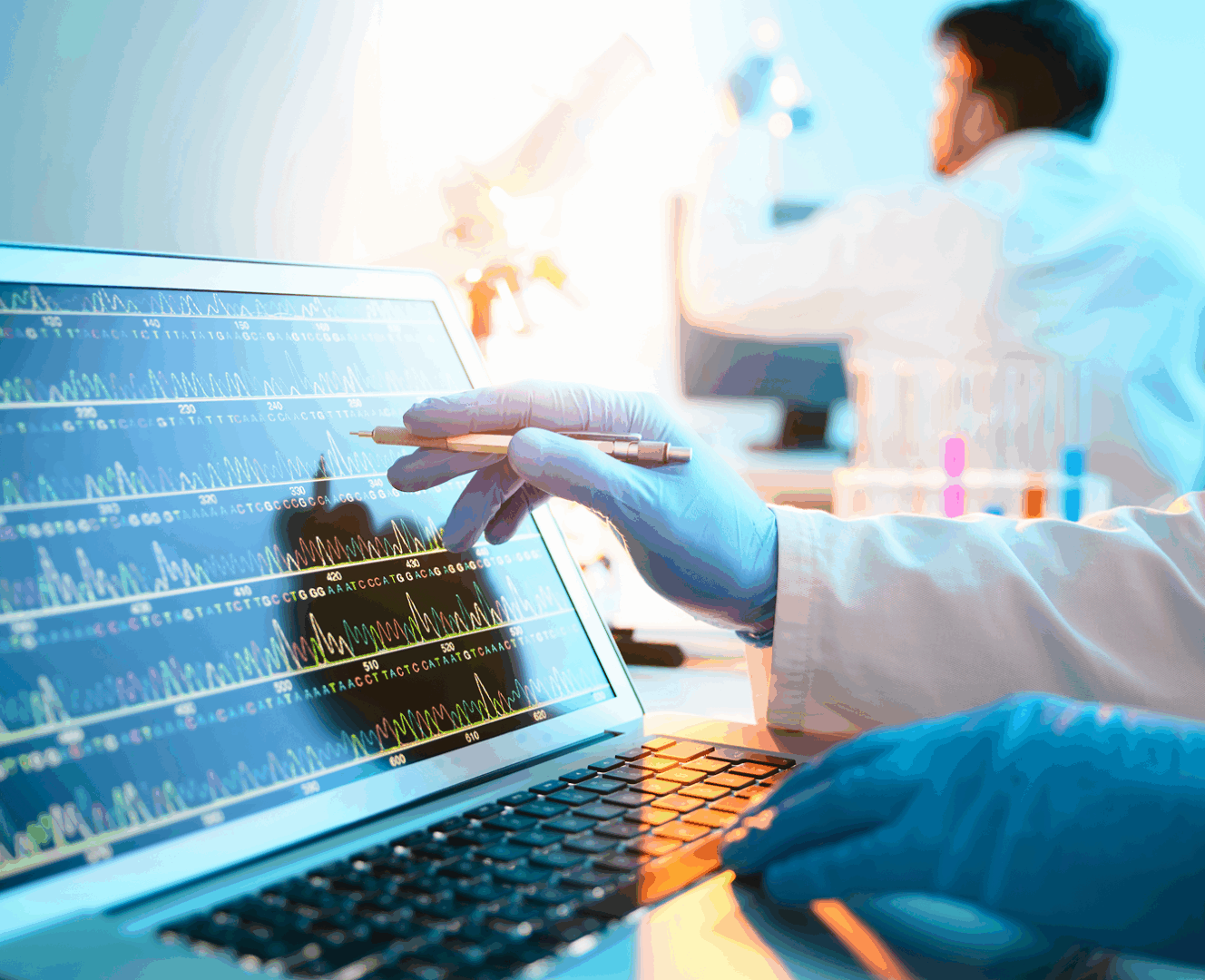 Laboratory researcher examining computer graphs